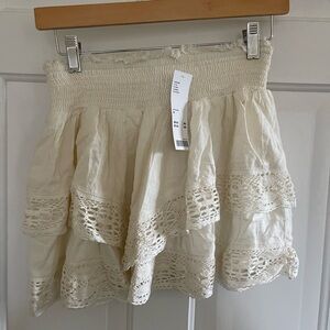 Off white mini skirt from urban outfitters. Size Medium. New with tags.